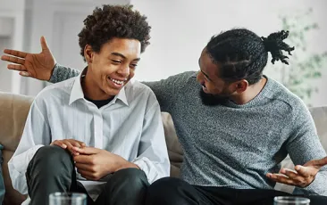 man and teen son having a discussion