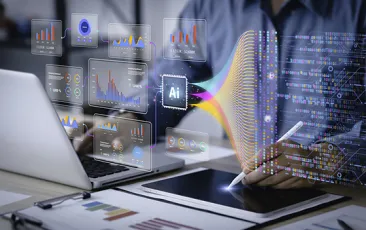 person working on laptop with overlay of data visualization