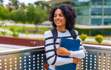 College student with books on campus