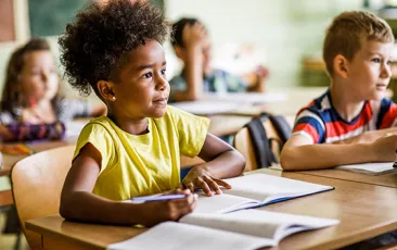Young girl listening in the classroom