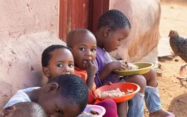 African children eating outside