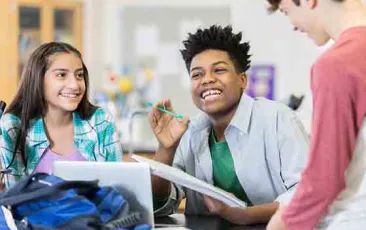 High school students laughing together in class