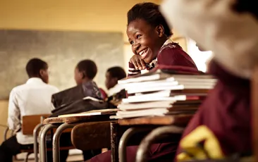 young african girl laughing in class