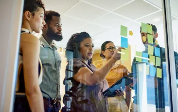 Business colleagues at a glass board
