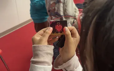 Girl holding microbit