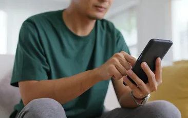 Parent looking at cell phone
