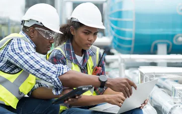 Construction apprentice with her trainer