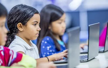 Elementary students in computer class