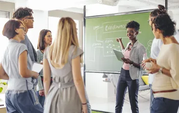 Teachers using computers in classroom