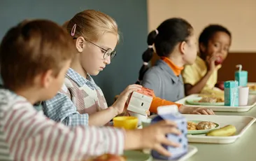 Girl eating school lunch