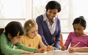 Teacher with young math students