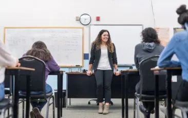 Teacher talking to students in math class.