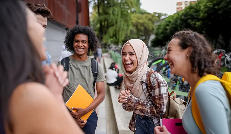 Young students laughing together on campus