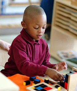 preschool boy playing with cubes