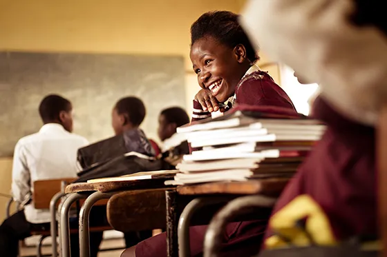 young african girl laughing in class