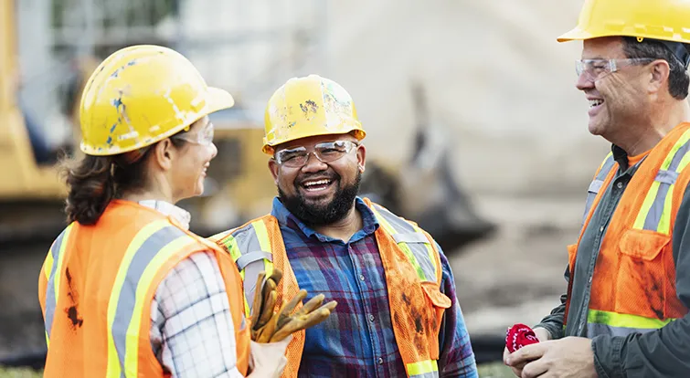 Construction workers laughing together