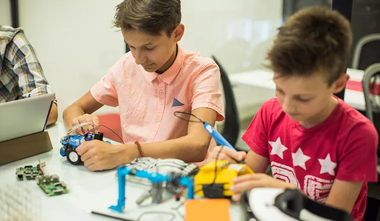 Kids working together in an afterschool tech program
