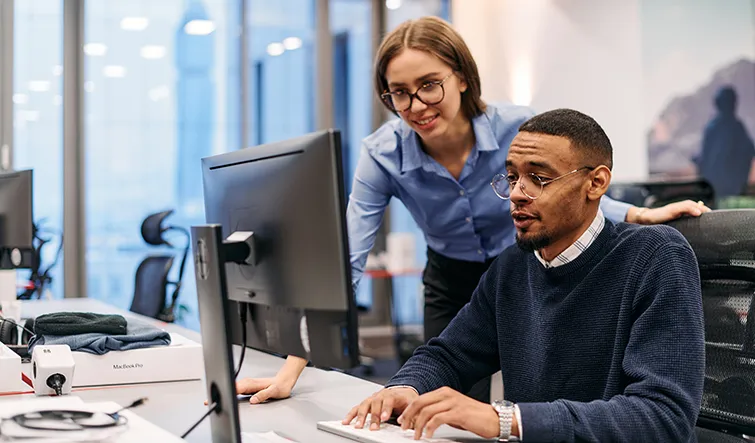 Coworkers at a computer