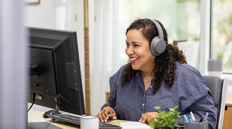 Adult learner using desktop computer