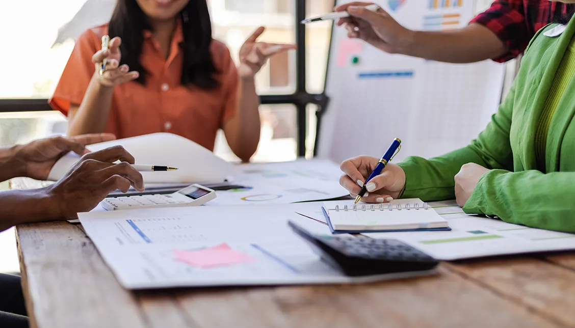 Colleagues working together at a desk