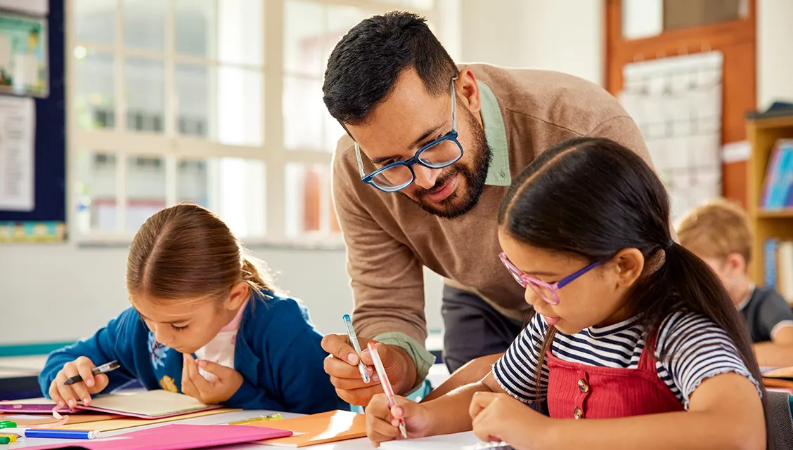 Male teacher with young students