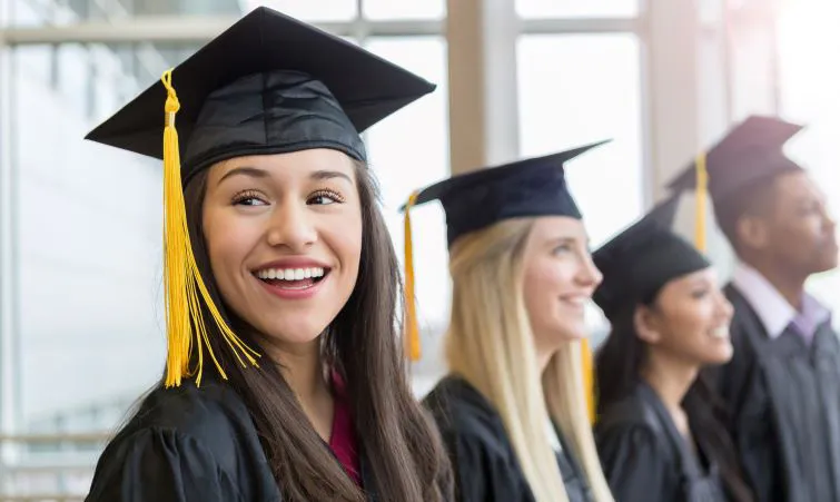 Smiling high school graduates