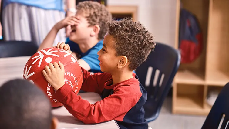 Boy with Special Olympics soccer ball