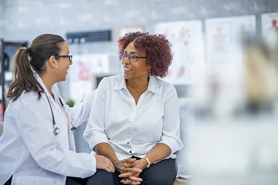 Health care worker with patient