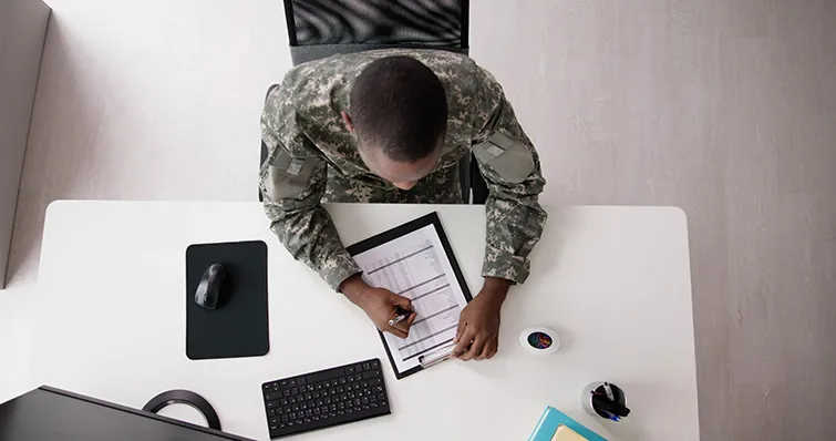 Soldier working on a document