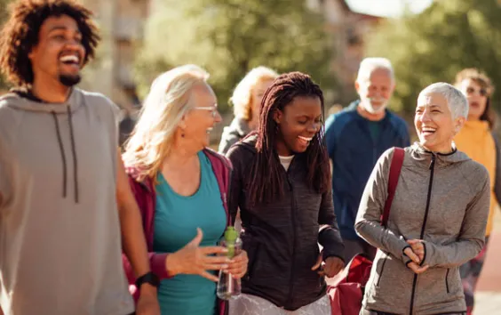 Group of adults laughing together outside