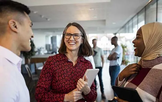 Diverse group of colleagues laughing