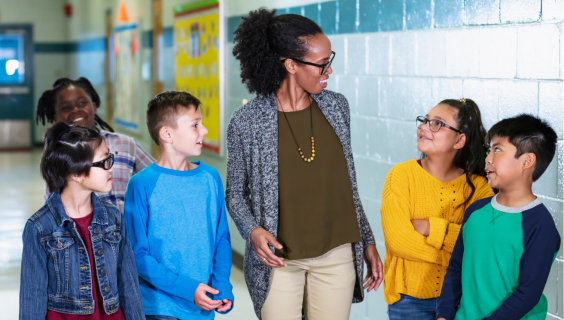 Teacher holding hands with students