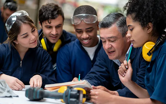 Factory workers with supervisor