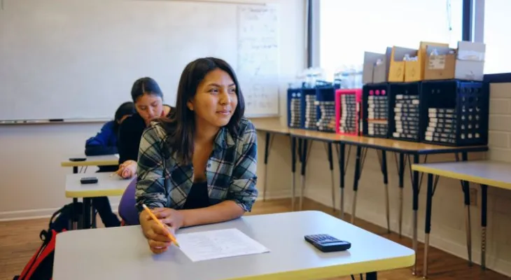 Student smiling in class.