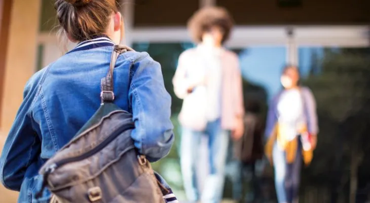 Student walking into school.