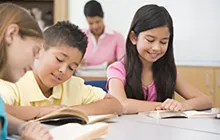 Image of boy and girl reading in classroom