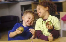 Preschool kids eating apples