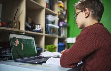 Image of boy distance learning on his laptop