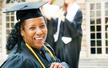 Older African American graduate in cap and gown