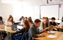 Students in classroom with iPad