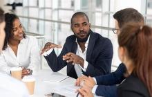 African American man leading a meeting