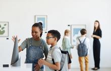 Kids looking at an exhibit in a museum