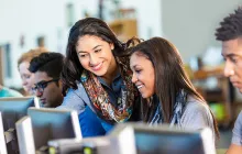 High school computer science teacher with students