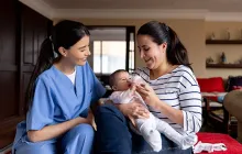 Home visit with mother and baby