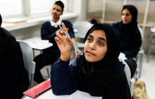 Diverse muslim children studying in classroom 