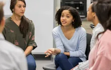 Teenage girl talks during support group meeting