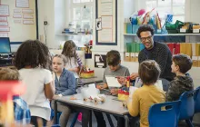 Teacher and young students in classroom
