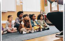 Children sitting on classroom floor