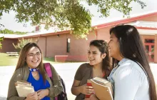 Native American students talking on campus