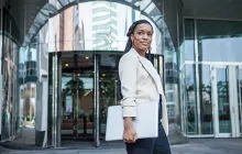 Young business woman outside office building